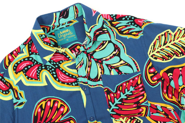 a loud originals shirt tropical tribe print floral with a blue background